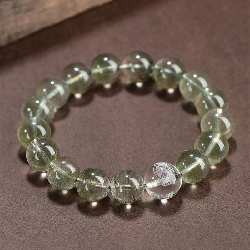 Wealth Guardian Chinese Zodiac Buddha Charm Bracelet - top view staged shot with green phantom crystal main beads