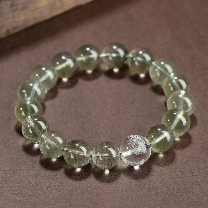 Wealth Guardian Chinese Zodiac Buddha Charm Bracelet - top view staged shot with green phantom crystal main beads