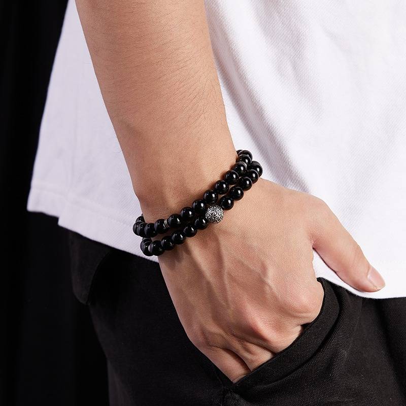 Wealth Guardian Double Wrap Bracelet - Protection &amp; Grounding - on wrist shot of the black obsidian bracelet