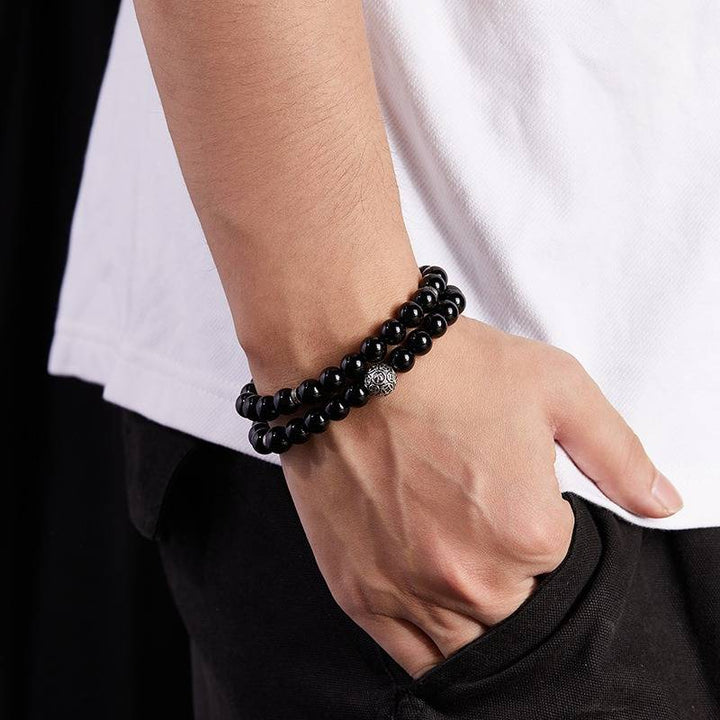 Wealth Guardian Double Wrap Bracelet - Protection &amp; Grounding - on wrist shot of the black obsidian bracelet