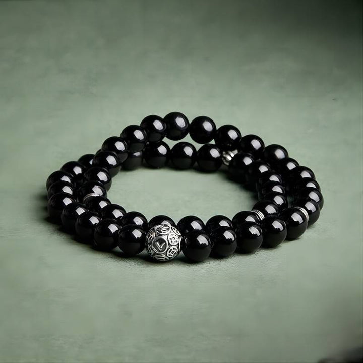 Wealth Guardian Double Wrap Bracelet - Protection &amp; Grounding - staged shot of the black obsidian bracelet