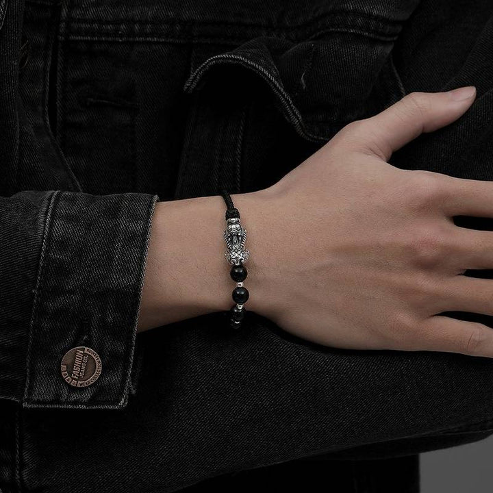 Wealth Guardian Pixiu Charm Bracelet  - On wrist wearing display shot of black obsidian and sliver braid bracelet