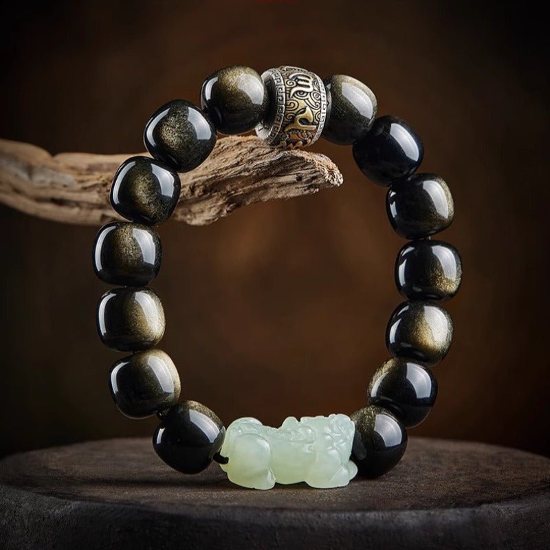 Wealth Guardian Pixiu & Mantra Charm Bracelet - Purification & Inner Peace - Resting on a natural driftwood base