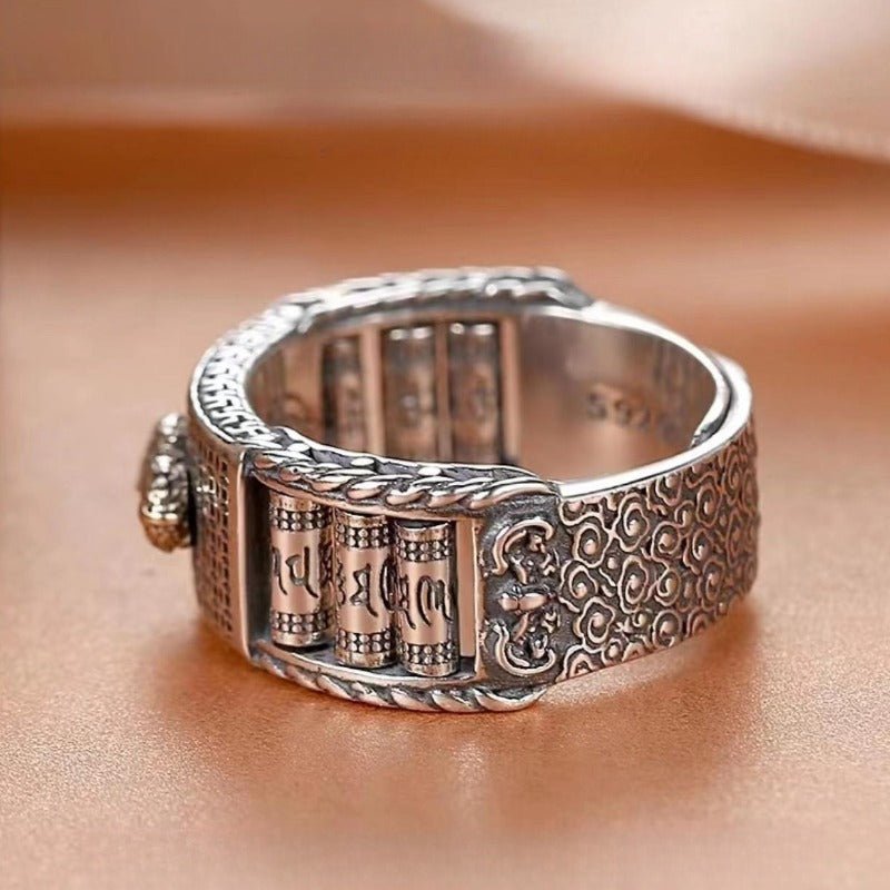 Wealth Guardian Pixiu & Spinning Prayer Wheels Ring - close up shot of the sterling sliver ring's prayer wheels