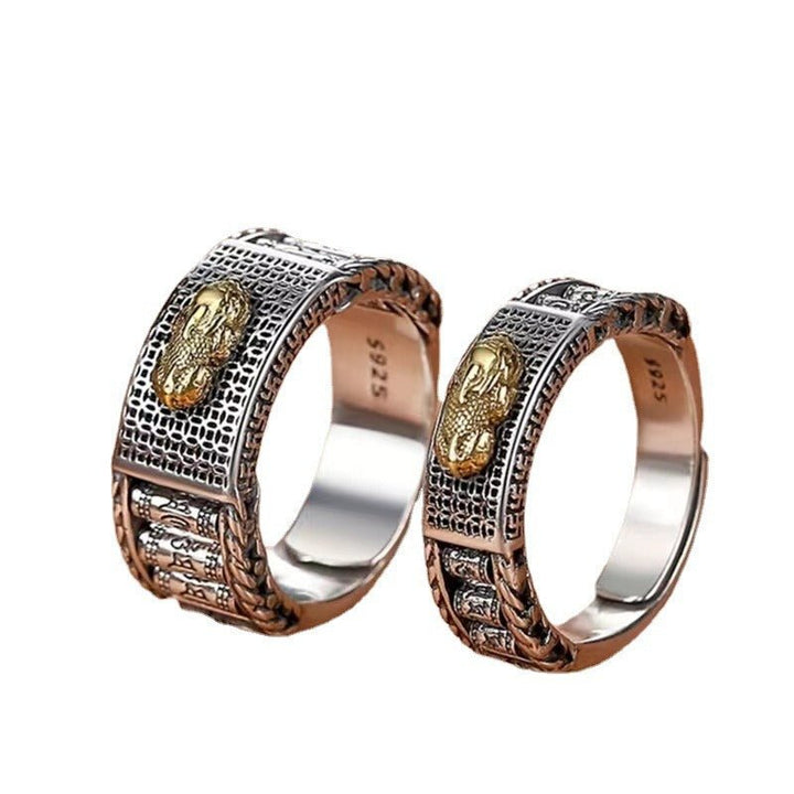 Wealth Guardian Pixiu &amp; Spinning Prayer Wheels Ring - close up shot of  two sterling sliver rings with white backgournd