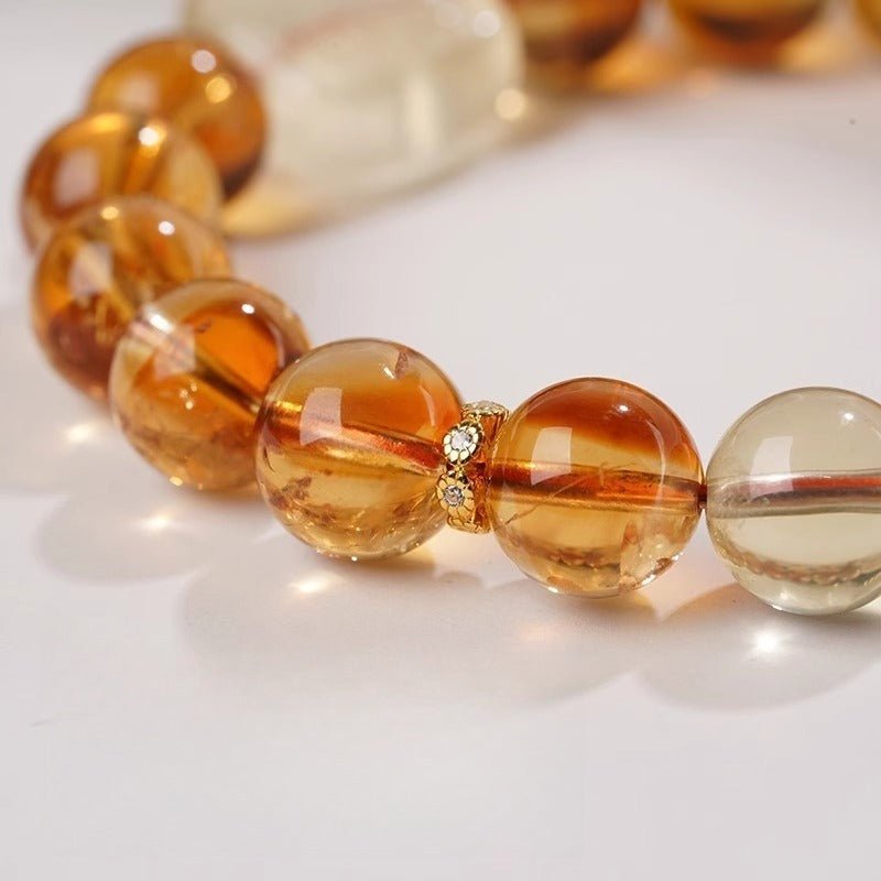 Wealth Guardian Zhamo Lama Charm Bracelet - Protection & Good Fortune - Close up shot of Citrine bracelet's main beads