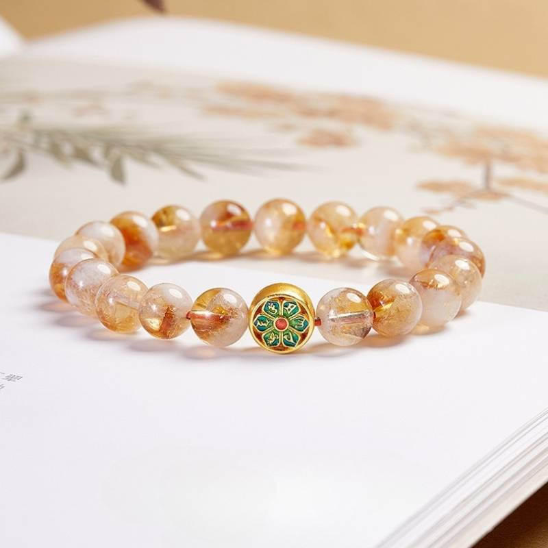 Wealth & Protection Mantra Citrine Bracelet - Harmony & Spiritual Connection - prop-styled shot focus on sliver master bead