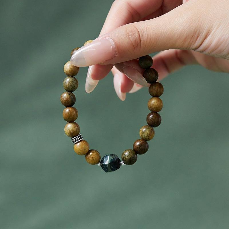 Wealth Wave Sandalwood Bracelet - Prosperity • Focus • Harmony - on-hand shot