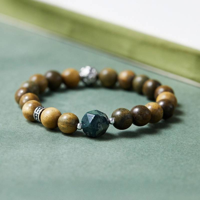 Wealth Wave Sandalwood Bracelet - Prosperity • Focus • Harmony - staged shot focus on master bead