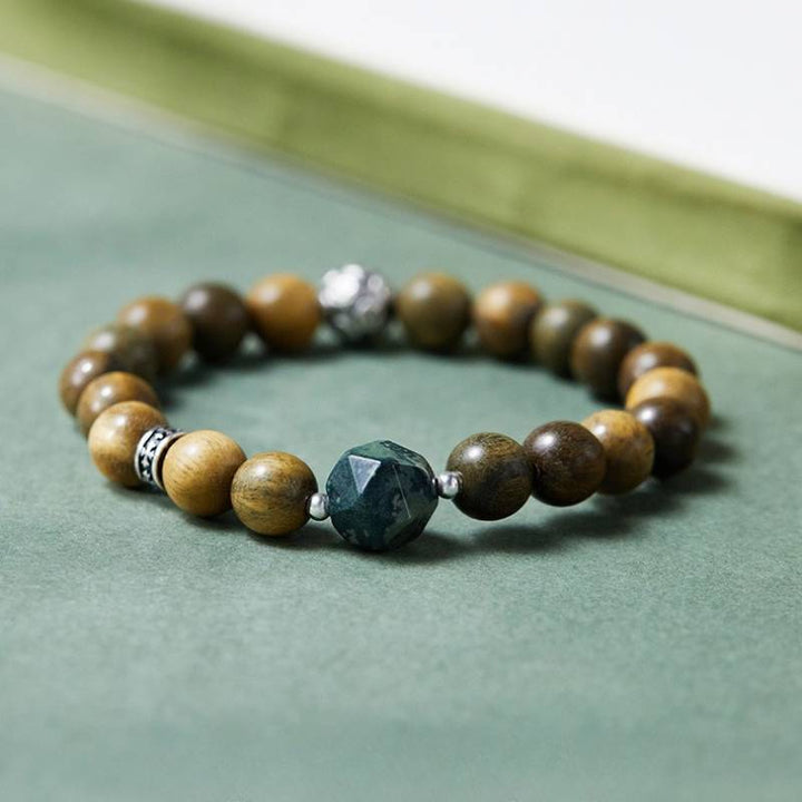 Wealth Wave Sandalwood Bracelet - Prosperity • Focus • Harmony - staged shot focus on master bead