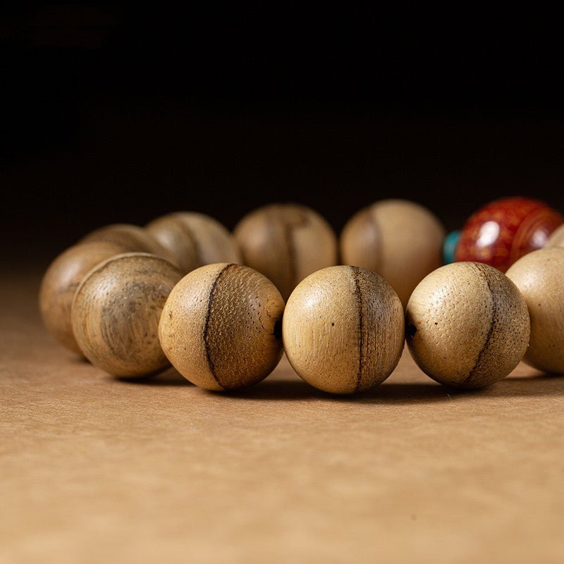 Wisdom &amp; Protection Heart Sutra Mantra Sandalwood Bracelet - close up shot of main beads