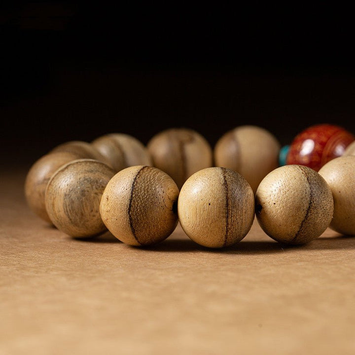 Wisdom &amp; Protection Heart Sutra Mantra Sandalwood Bracelet - close up shot of main beads